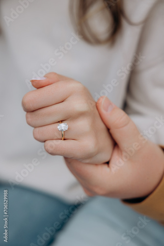hand with a bridal ring, heart proposal, ring with a large diamond stone