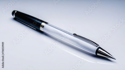 Black and white pen lies diagonally, pen for business, office and school, educational supplies, on white insulated background