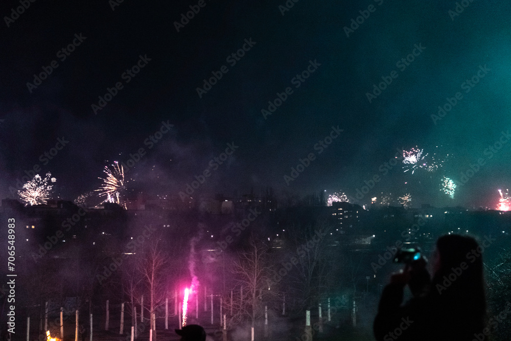 Capturing the Magic of New Year's Eve: Berlin Skyline Illuminated by Dazzling Fireworks Celebration in a City Alive with Joy and Lights