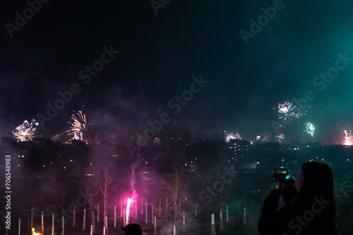 Capturing the Magic of New Year's Eve: Berlin Skyline Illuminated by Dazzling Fireworks Celebration in a City Alive with Joy and Lights © Josue