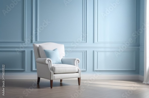 Cozy interior in classic style. Blue walls with stucco, molding and comfortable armchair.