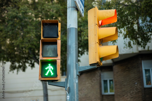 Pedestrian Crossing green light - Yellow Painted Traffic Signal on Steel Pole in Barcelona, Spain