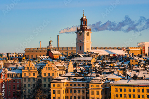 Rooftop view of the old town and The German church in Stockholm, Sweden, on a cold winter day, snow and morning sunshine.