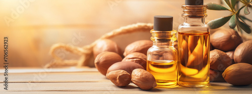 argan essential oil on a wooden background. photo