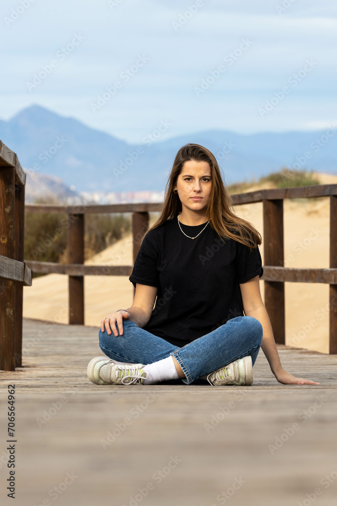Young girl sitting on the floor Young girl sitting on the floor