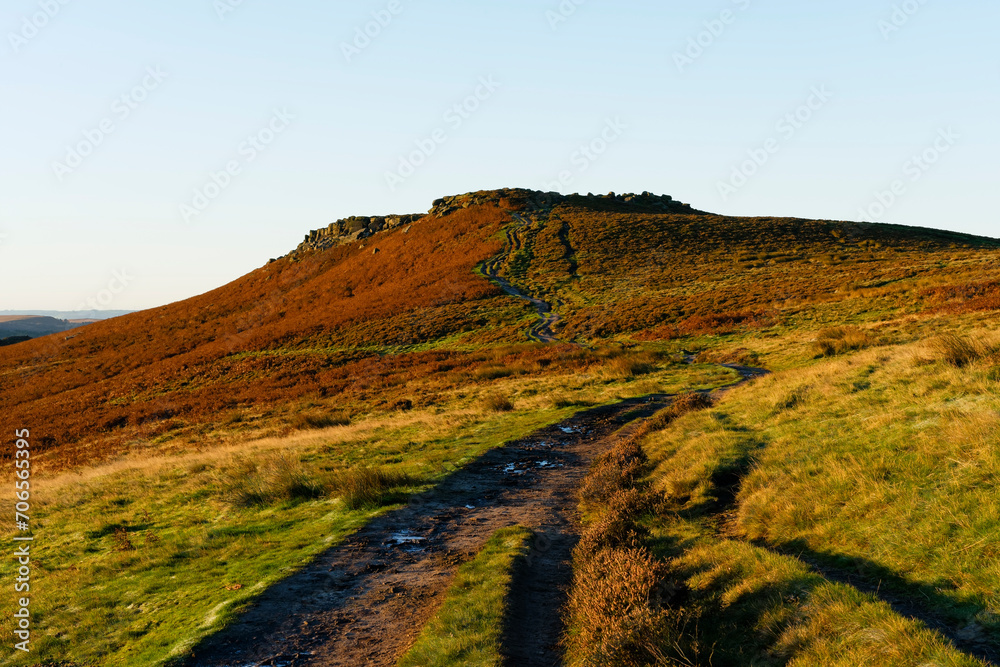 Muddy, winding footpath to the top of Higger Tor in Derbyshire.