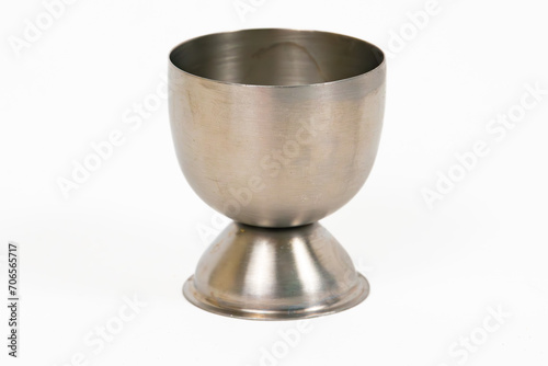 A brushed stainless steel egg cup isolated on a white background