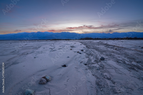 Aftermath of flooding in Death Valley looking west as the sun sets photo