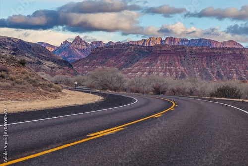 Panoramic picture of a lonely road through mountainous desert