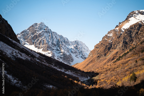 Impressive highlands in the autumn winter season on a bright sunny day, stunning snowy mountains, Teberda National Park, Karachay-Cherkessia photo