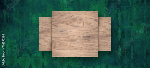 Square shaped wooden blocks in front of abstract green backdrop. Message text field space. Horizontal banner is used for banners.