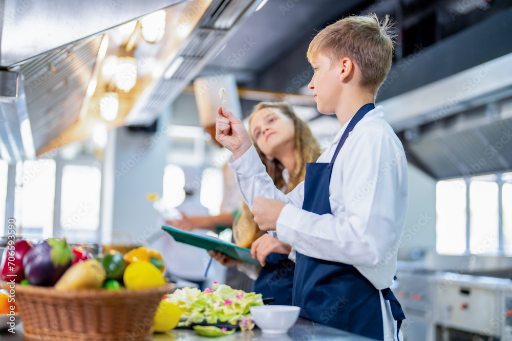Young chef cooking at restaurant kitchen. Young chef cooking at restaurant kitchen.