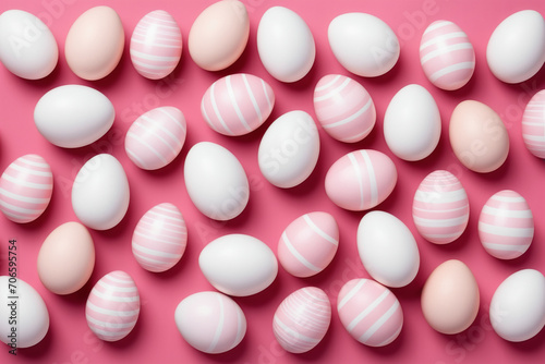 Pattern of pink and white Easter eggs over pink background