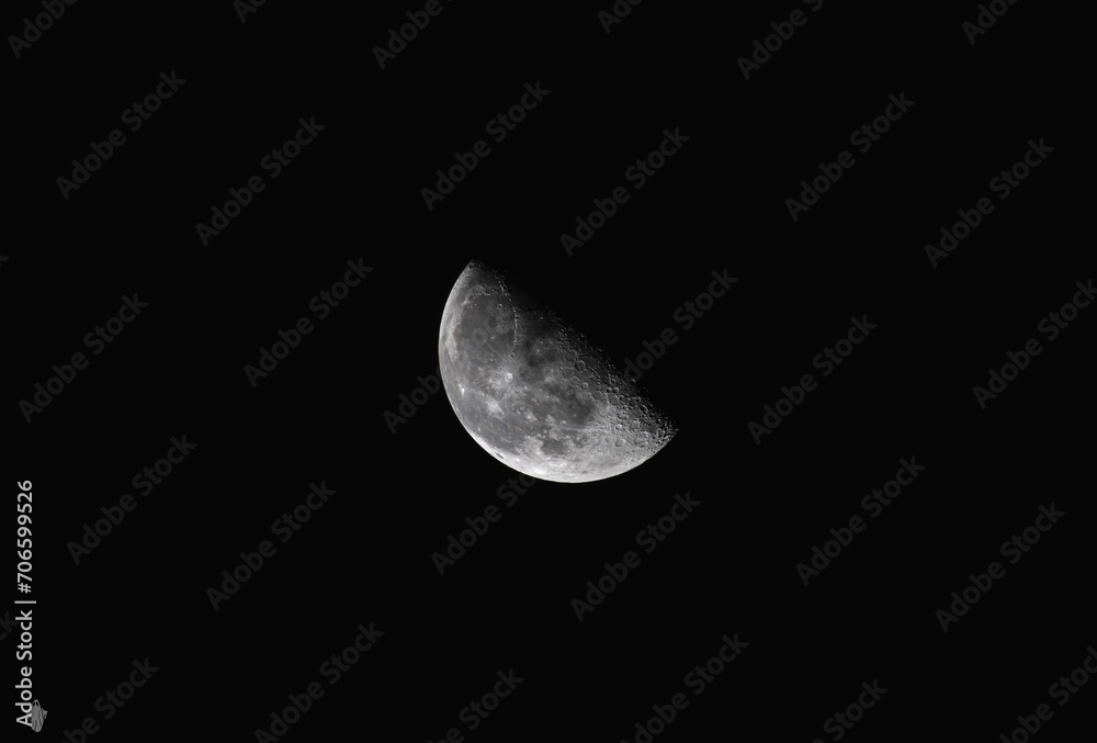 the surface of the moon, showing the details of it's craters and the shadows the surface of the moon, showing the details of it's craters and the shadows