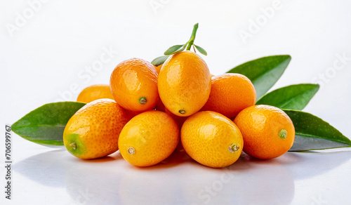 Kumquat with leaves on white background