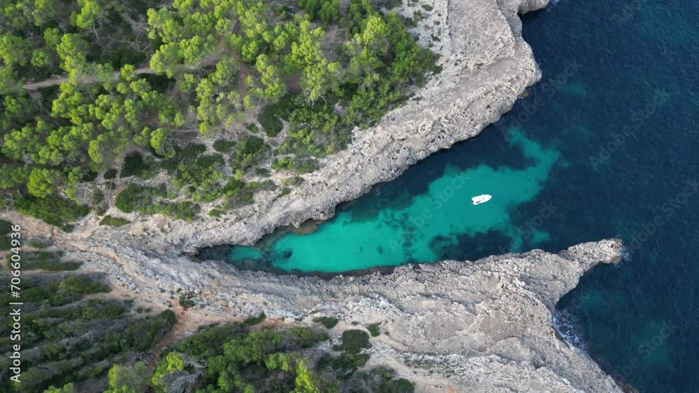 Mallorca, Balearic Islands, Spain. Tropical paradise turquoise bay. Beautiful Mediterranean cave rocky sandy beach with blue water, sunny day in Majorca. Famous tourist attraction Cala Mondrago Beach