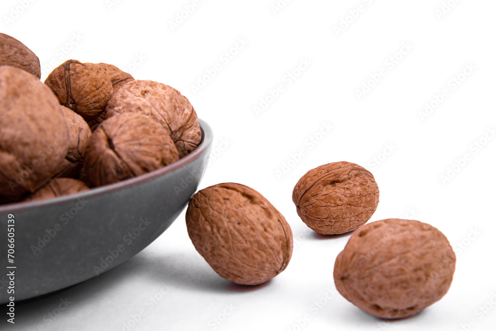 Walnuts are on a plate. Isolate. Ingredients. Diet and weight loss. Vitamins. Walnuts are on a plate. Isolate. Ingredients. Diet and weight loss. Vitamins.