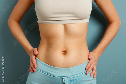 A frontal view of a female abdomen devoid of tattoos, showcasing goosebumps, natural belly contours, and realistic skin texture, without any costumes.