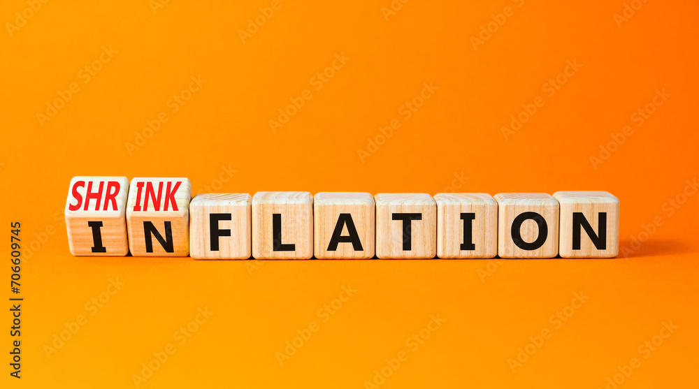 Inflation or shrinkflation symbol. Concept words Inflation Shrinkflation on beautiful wooden blocks. Beautiful orange table orange background. Business inflation shrinkflation concept. Copy space Inflation or shrinkflation symbol. Concept words Inflation Shrinkflation on beautiful wooden blocks. Beautiful orange table orange background. Business inflation shrinkflation concept. Copy space