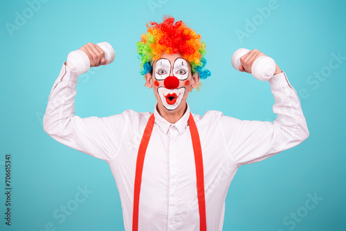 Funny clown and different situations. A happy guy goes in for sports. Blue background.
