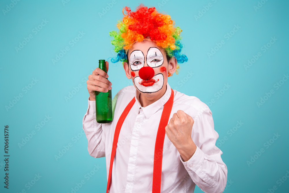 Funny clown and different situations. The guy drinks beer. Blue background. Funny clown and different situations. The guy drinks beer. Blue background.