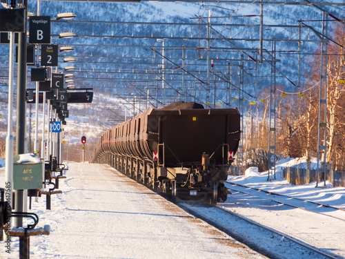 A freight train transporting iron ore from Kiruna, Sweden to Narvik, Norway. Winter 2023. Western Europe photo