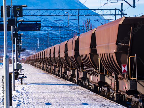 A freight train transporting iron ore from Kiruna, Sweden to Narvik, Norway. Winter 2023. Western Europe photo