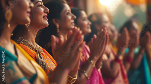A group of women clapping and singing folk songs during Navratri, Navratri, blurred background, with copy space photo
