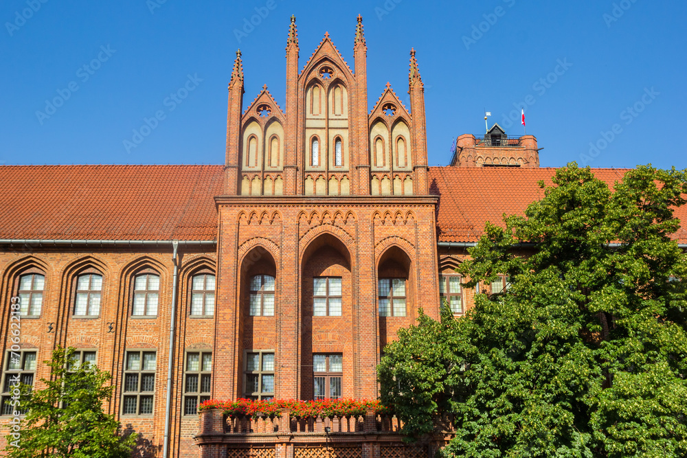 Front facade of the historic town hall building in Torun, Poland
