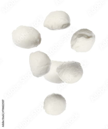 Fresh mozzarella balls falling on white background