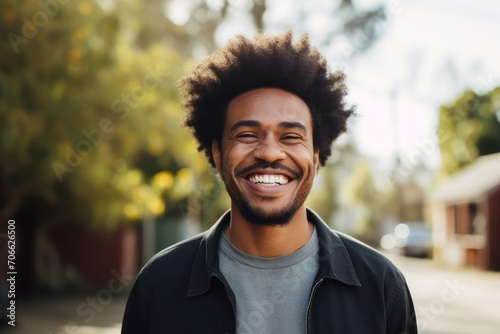 Energetic man afro smiling. Male portrait on color background. Generate Ai © juliars