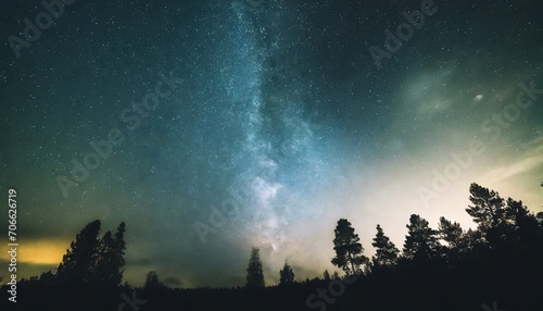 abstract time lapse night sky with shooting stars over forest landscape milky way glowing lights background