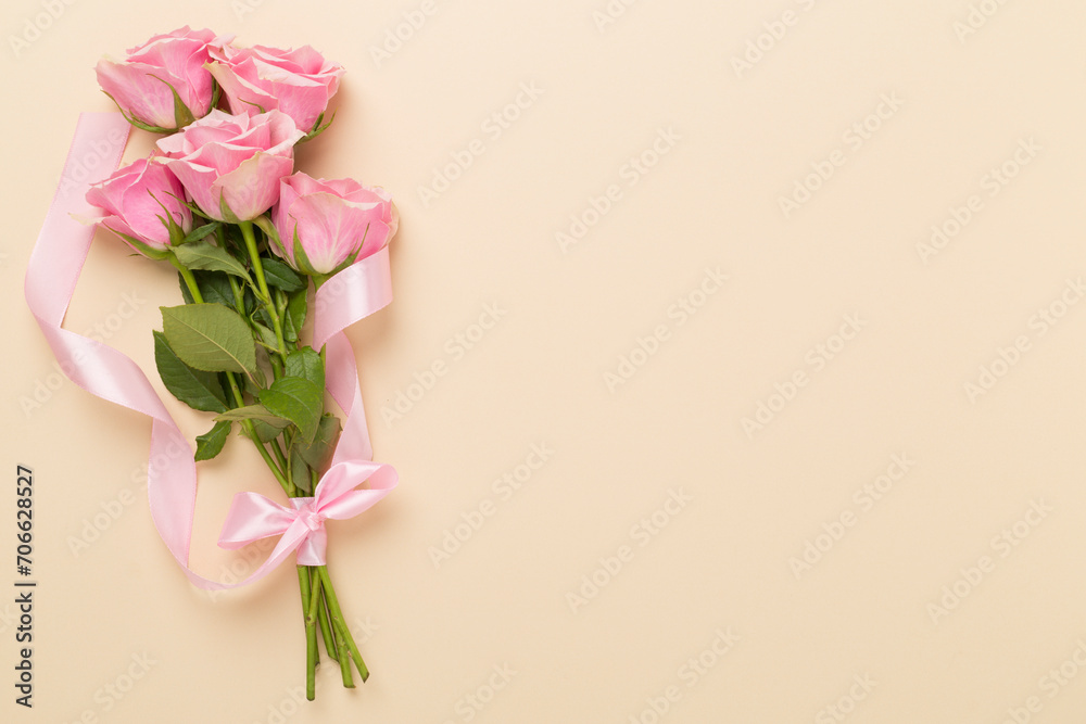 Pink roses on color background, top view. Valentines day concept