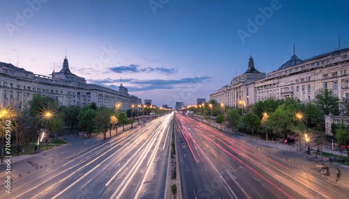 traffic in the center of the capital city of romania bucharest at dusk
