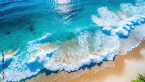 summer seascape beautiful waves blue sea water in sunny day top view from drone sea aerial view amazing tropical nature background beautiful bright sea with waves splashing and beach sand concept