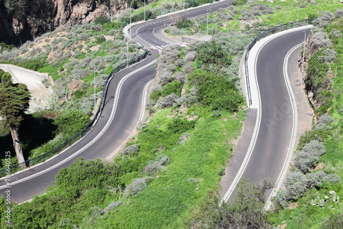 Curvy asphalt road. Mountain road background. Down the hill canyon. Highway curve. Top view road.