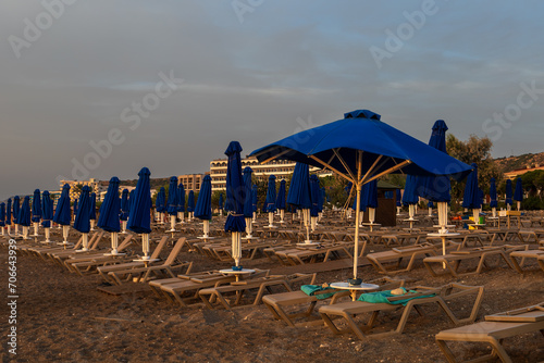Beach by the sea on the island of Rhodes in Greece. Parasols and sunbeds on the beach. © Roman Bjuty