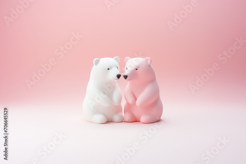 Two pink and white polar bear figurines on pink background. Photo of cute toy bears couple with space for text. Concept of love  Valentine s Day  Birthday  wedding. For banner  poster  card  postcard