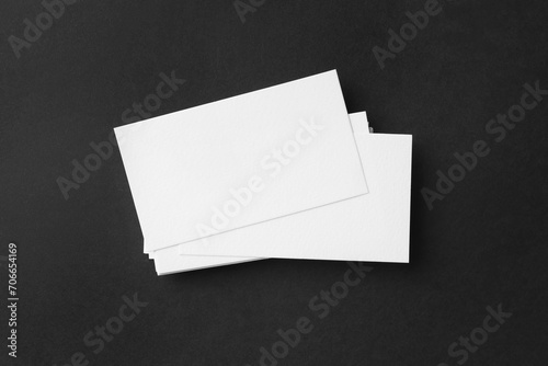 Blank business cards on black background, top view. Mockup for design © New Africa