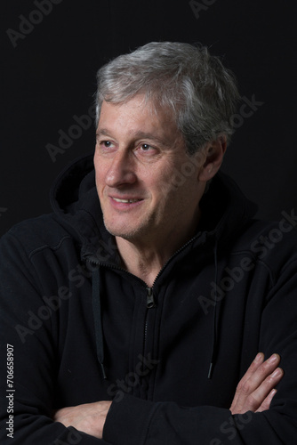 relaxed man looking to the side establishing communication with someone out of frame