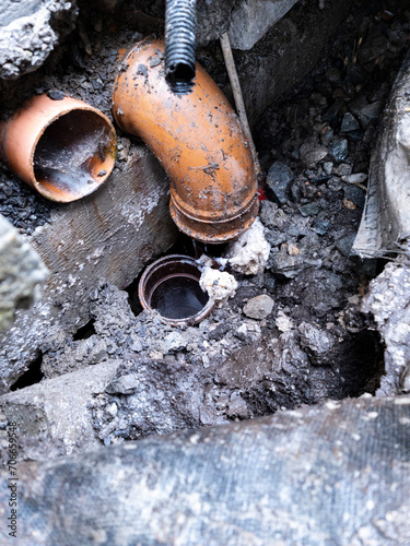 Broken pipes due to subsidence of building on a peatbog photo