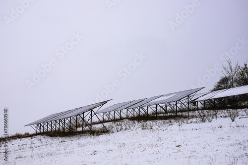 Solar panels Photocells on a gloomy foggy frosty winter day in the countryside. Solar batteries are an alternative energy