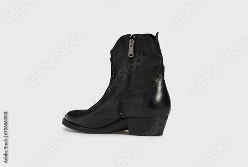 Back view on blank black women's fashion cossack Cowboy boot isolated on white background. Female classic spring autumn shoe with Pointy Toe, heel. Leather casual footwear in futuristic style. Mock up
