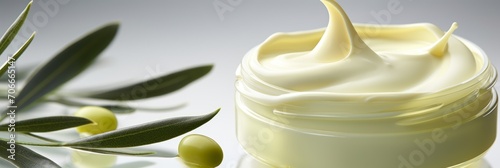 Face lotion cream sample, olive cream sample on a light background, lotion texture, a smear of moisturizer closeup, beauty and skin care concept, banner photo