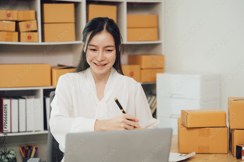 Two asian women with startup small business entrepreneur freelance working at home. checking product order. Online woman sellers working for e- Two asian women with startup small business entrepreneur freelance working at home. checking product order. Online woman sellers working for e-