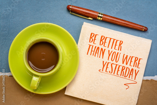 Be better than you were yesterday - motivational text on a napkin with coffee, personal development concept.