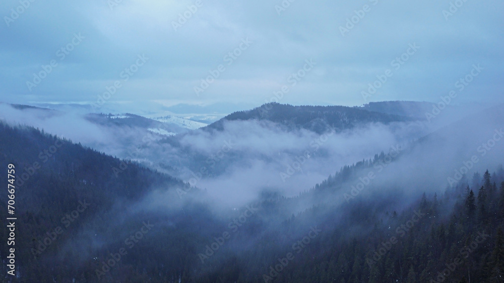 Winter Carpathian mountains in the fog. Ukraine