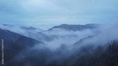 Winter Carpathian mountains in the fog. Ukraine