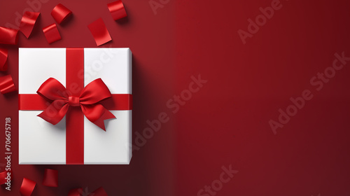 Blank white gift box open or top view of white present box tied with red ribbon bow isolated on dark red background with shadow minimal conceptual