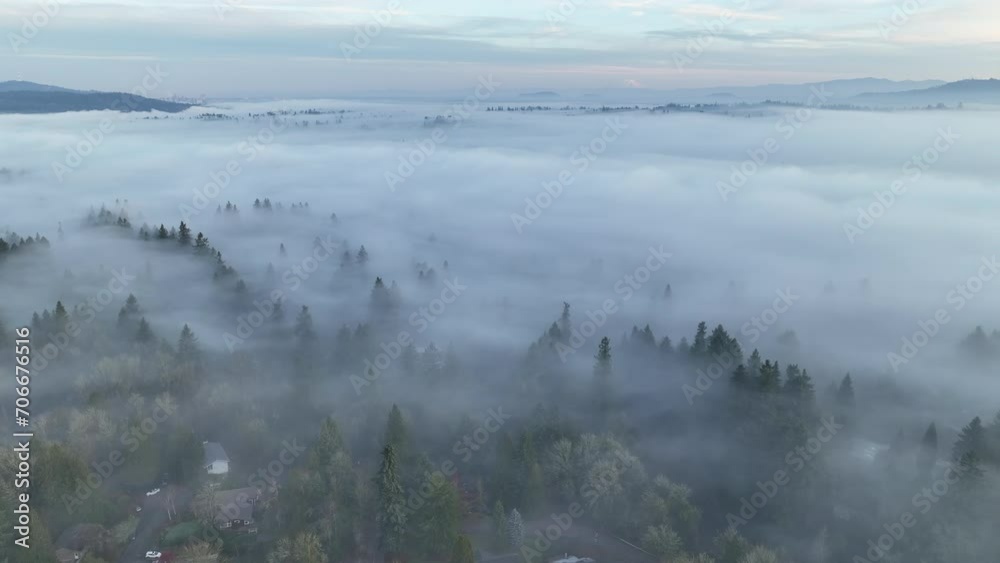 With Mt. Hood in the distance, dense fog covers the Willamette Valley in Oregon, not far south of Portland. This Pacific Northwest region is known for its beautiful forests and wet weather.
